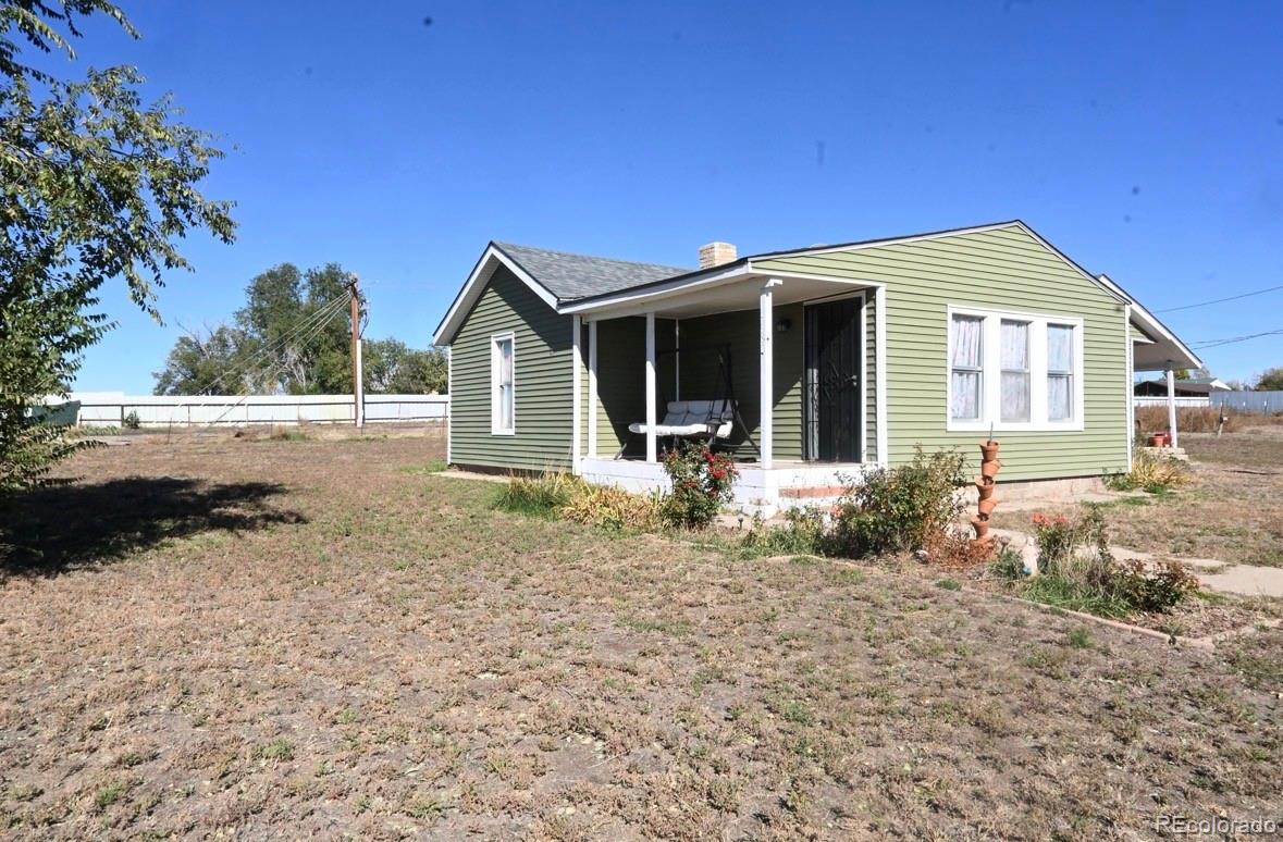 7992 County Road 31 Fort Lupton, CO 80621 - Photo 2 of 14 a view of a house with a yard