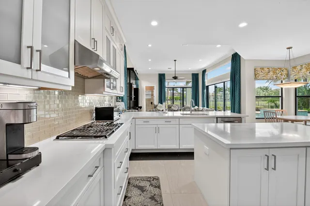 a bathroom with a double vanity sink a mirror and a bathtub