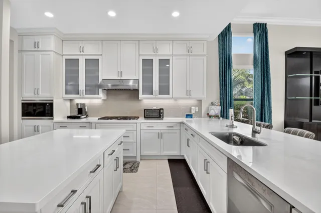 a bathroom with a toilet sink vanity and shower