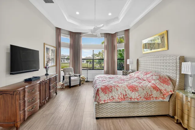 a view of a house with a swimming pool and a yard