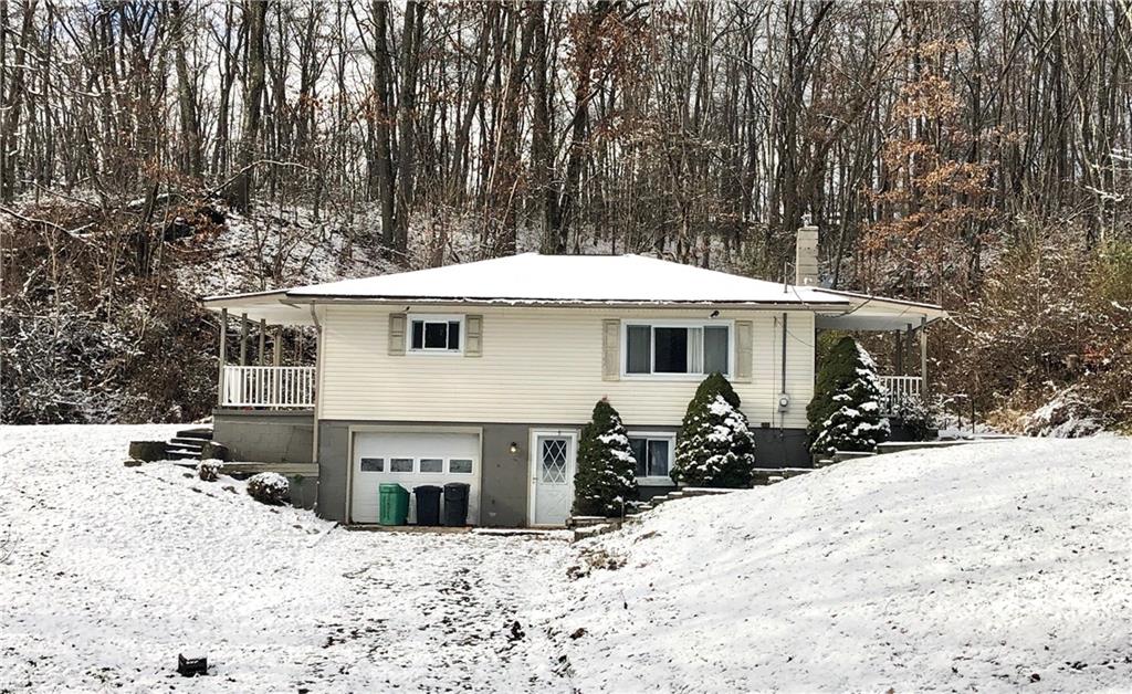 132 Park Road Apollo, PA 15613 - Photo 1 of 22 Front faade with two driveways and two covered patios.