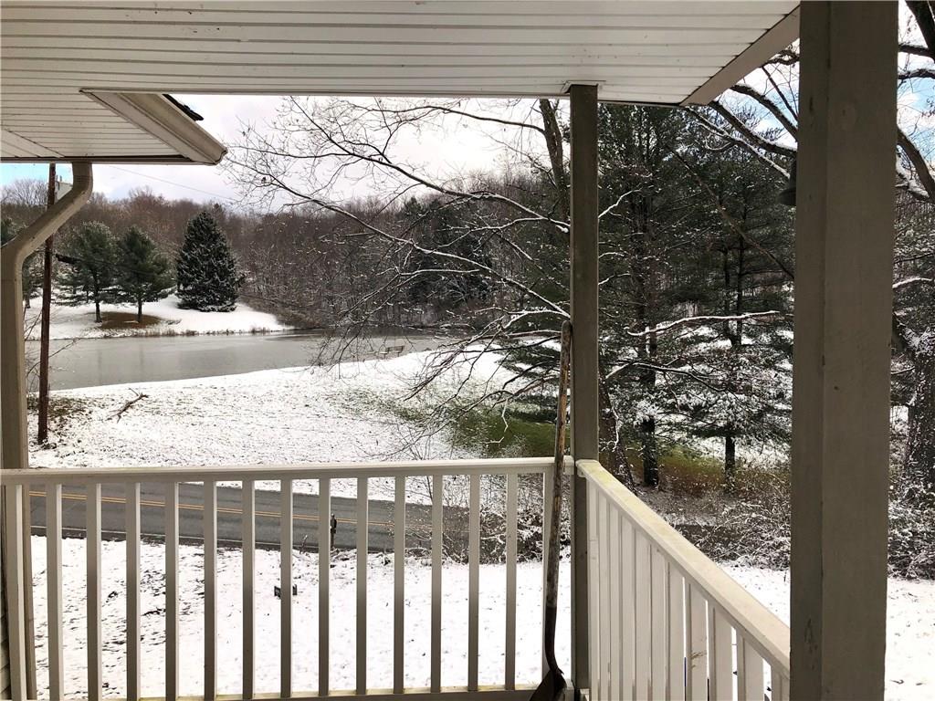 132 Park Road Apollo, PA 15613 - Photo 6 of 22 The side covered patio with views of the lake.