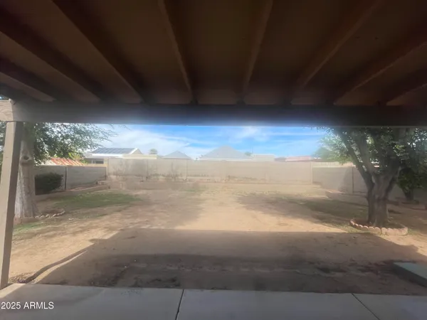 a view of an empty room with a fireplace
