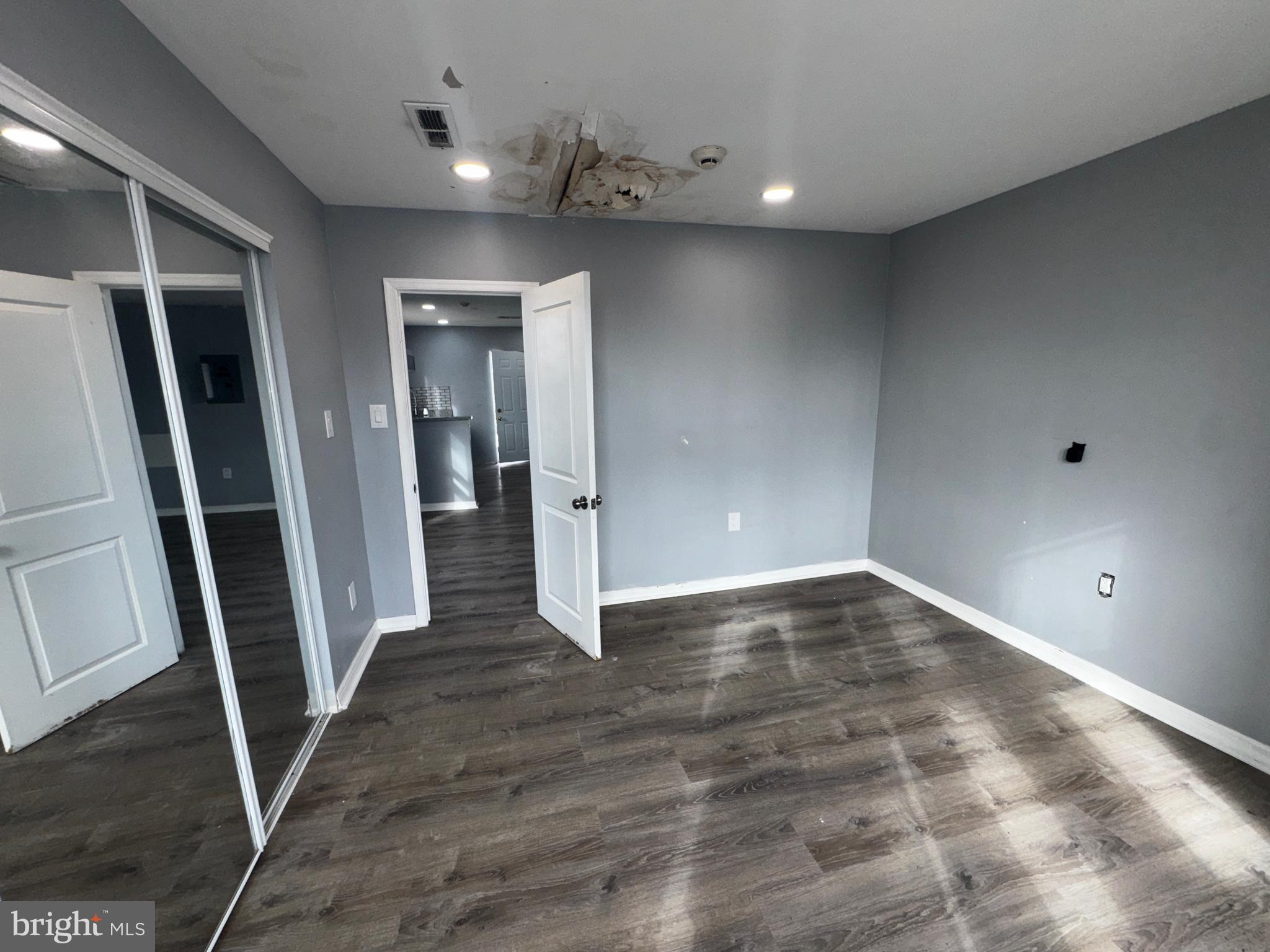 700 Lloyd Street Chester, PA 19013 - Photo 23 of 32 an empty room with wooden floor and entrance