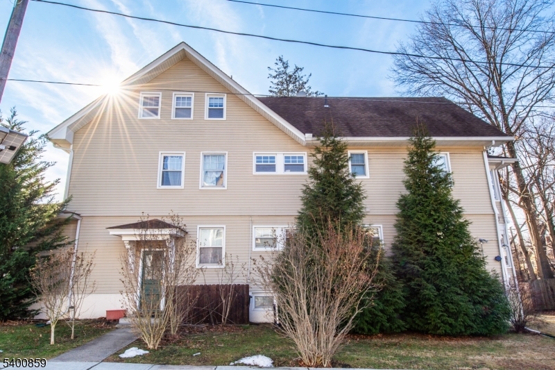 422 Valley Road, Unit 1 Montclair, NJ 07043 - Photo 22 of 24 a front view of a house with garden