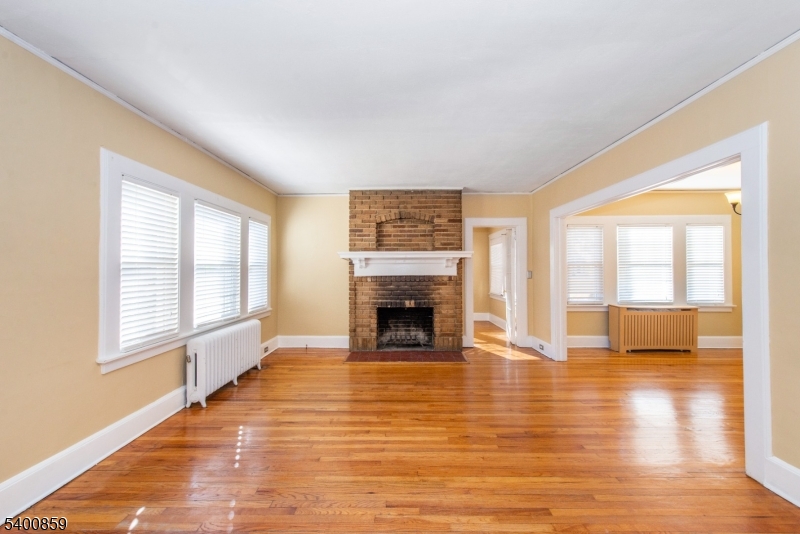 422 Valley Road, Unit 1 Montclair, NJ 07043 - Photo 6 of 24 a view of an empty room with a window and fire place