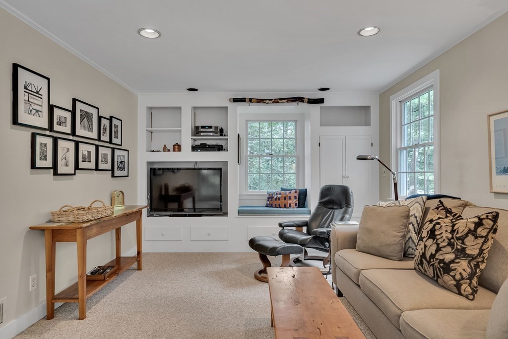 25 Fair Oaks Drive Lexington, MA 02421 - Photo 13 of 27 a living room with furniture and a fireplace