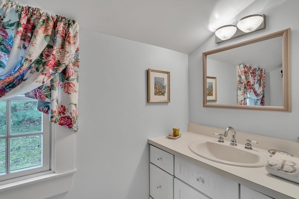 25 Fair Oaks Drive Lexington, MA 02421 - Photo 18 of 27 a bathroom with a sink mirror and vanity