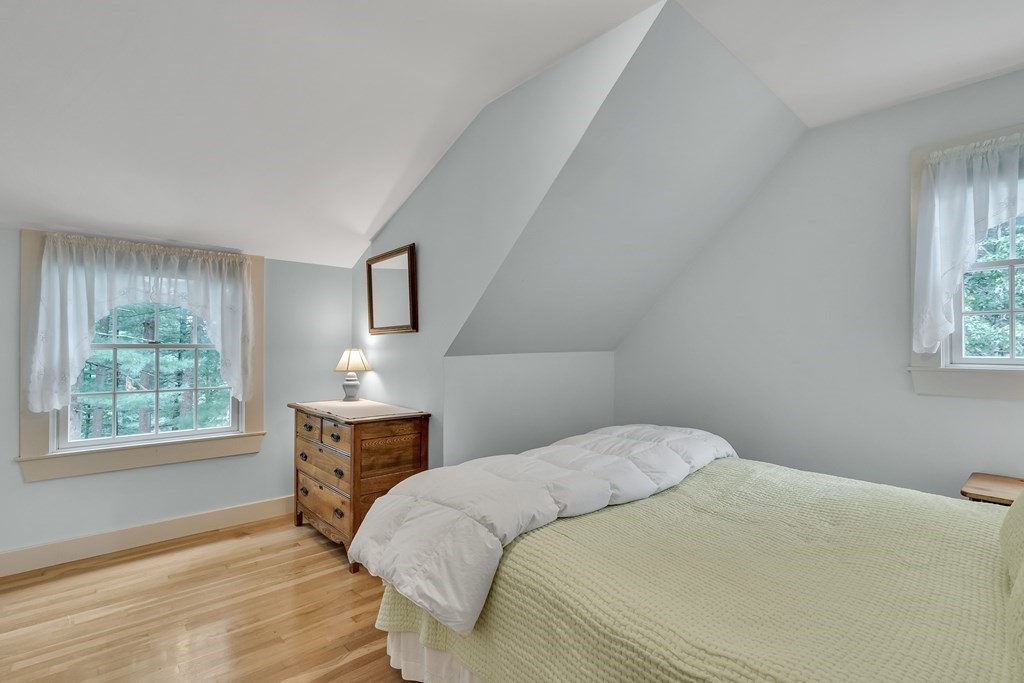 25 Fair Oaks Drive Lexington, MA 02421 - Photo 19 of 27 a bedroom with a bed wooden floor and window