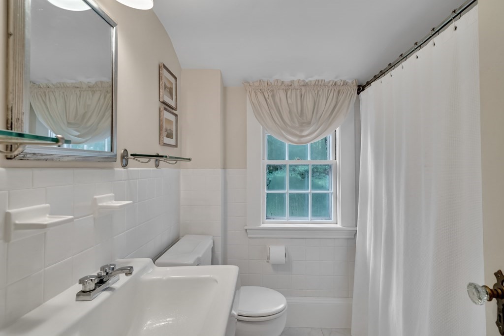 25 Fair Oaks Drive Lexington, MA 02421 - Photo 22 of 27 a bathroom with a sink a toilet and shower
