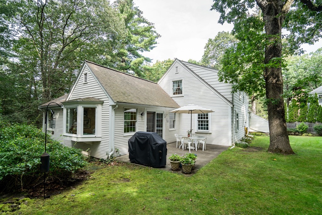 25 Fair Oaks Drive Lexington, MA 02421 - Photo 25 of 27 a front view of house with a garden and patio