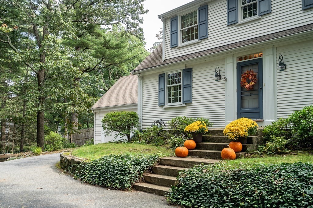25 Fair Oaks Drive Lexington, MA 02421 - Photo 3 of 27 a front view of a house with plants and garden