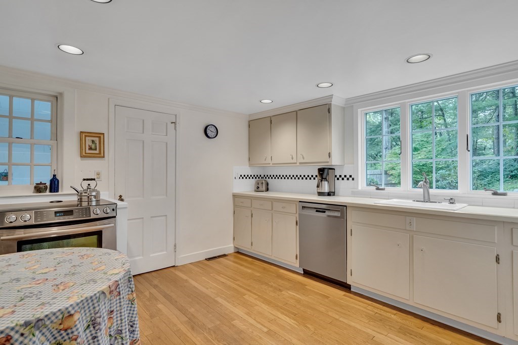 25 Fair Oaks Drive Lexington, MA 02421 - Photo 9 of 27 a kitchen with a stove a sink and a refrigerator