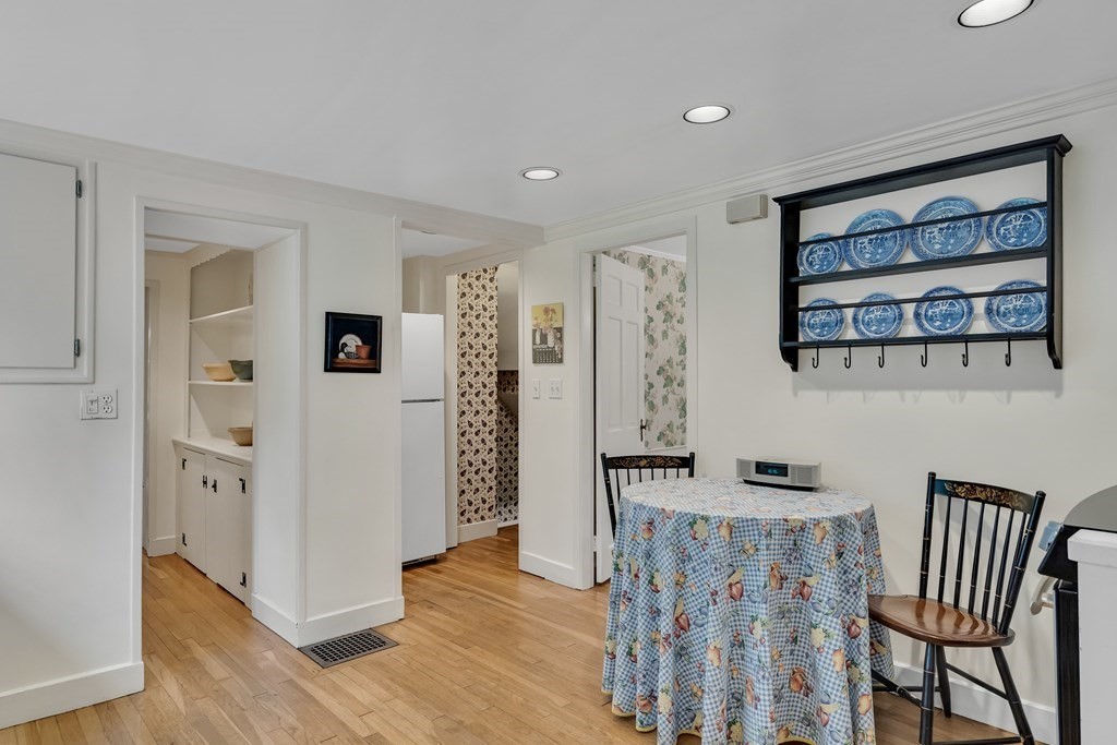 25 Fair Oaks Drive Lexington, MA 02421 - Photo 10 of 27 a view of a hallway with wooden floor and furniture