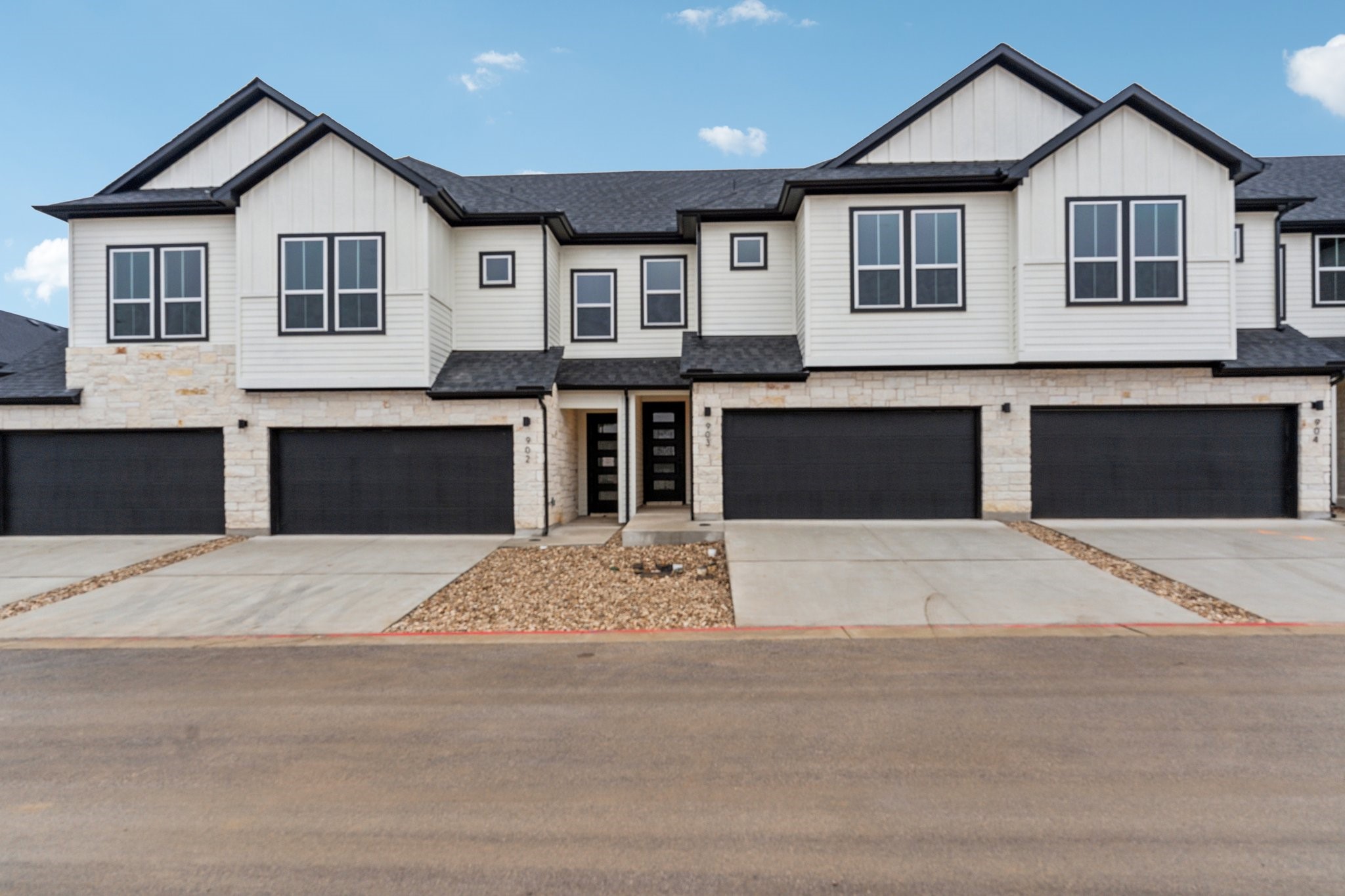 a front view of a house with yard