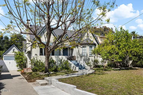 a front view of a house with garden