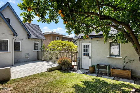 a backyard of a house with seating space