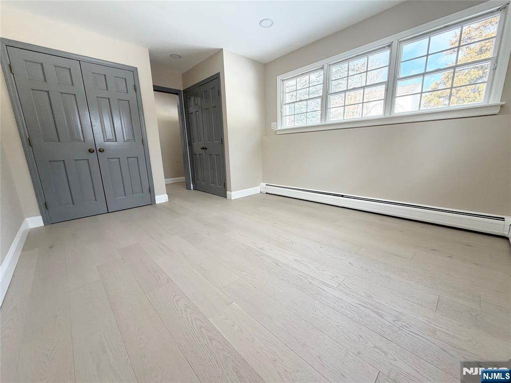 850 Ridgewood Avenue Oradell, NJ 07649 - Photo 12 of 48 an empty room with windows
