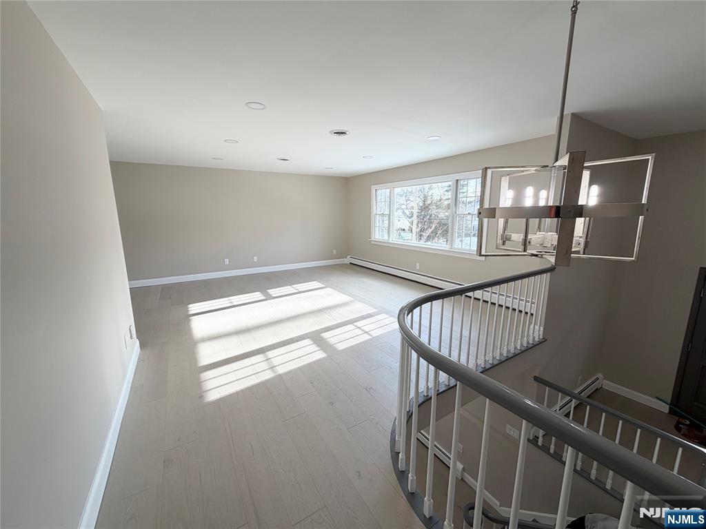 850 Ridgewood Avenue Oradell, NJ 07649 - Photo 18 of 48 a view of an empty room with wooden floor