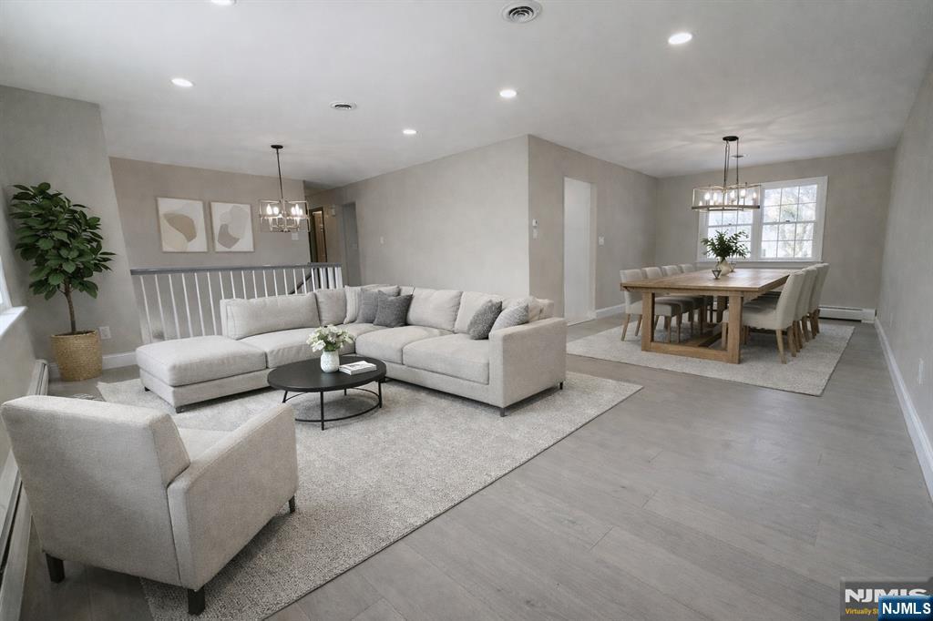850 Ridgewood Avenue Oradell, NJ 07649 - Photo 19 of 48 a living room with furniture and a chandelier