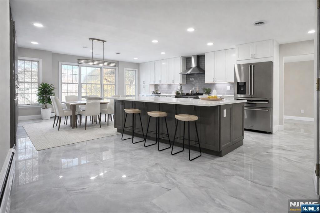 850 Ridgewood Avenue Oradell, NJ 07649 - Photo 23 of 48 a large kitchen with a table and chairs