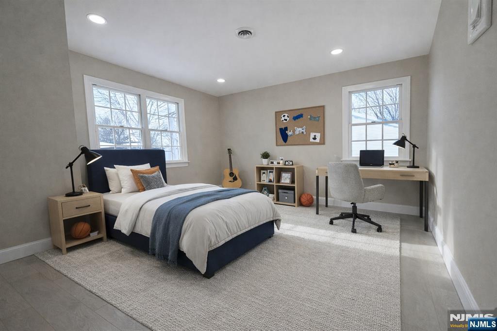 850 Ridgewood Avenue Oradell, NJ 07649 - Photo 31 of 48 a spacious bedroom with a bed and window