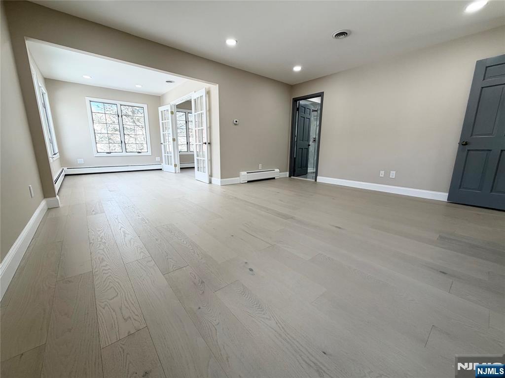 850 Ridgewood Avenue Oradell, NJ 07649 - Photo 36 of 48 an empty room with windows and closet