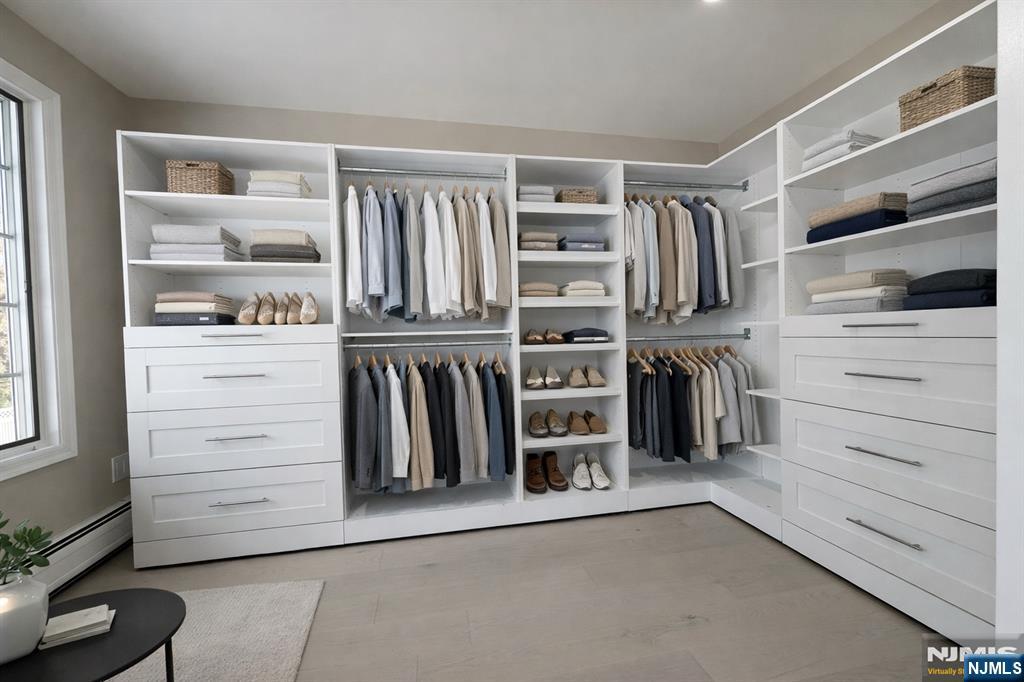 850 Ridgewood Avenue Oradell, NJ 07649 - Photo 38 of 48 a view of walk in closet with clothes and shoes