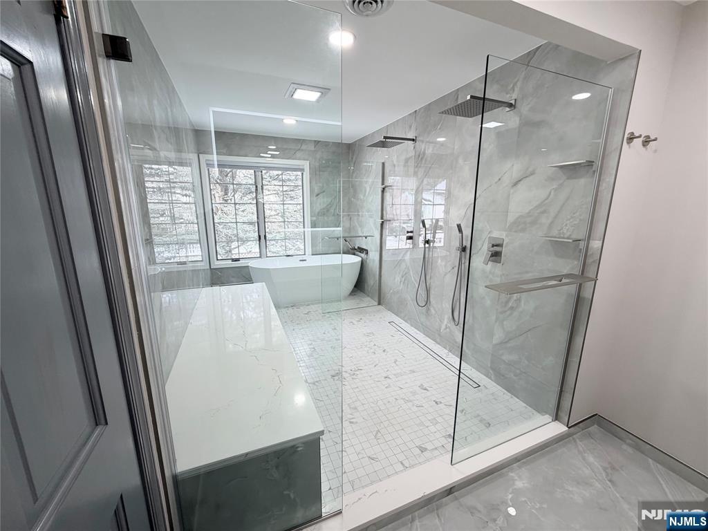 850 Ridgewood Avenue Oradell, NJ 07649 - Photo 42 of 48 a large white bathroom with a glass shower door