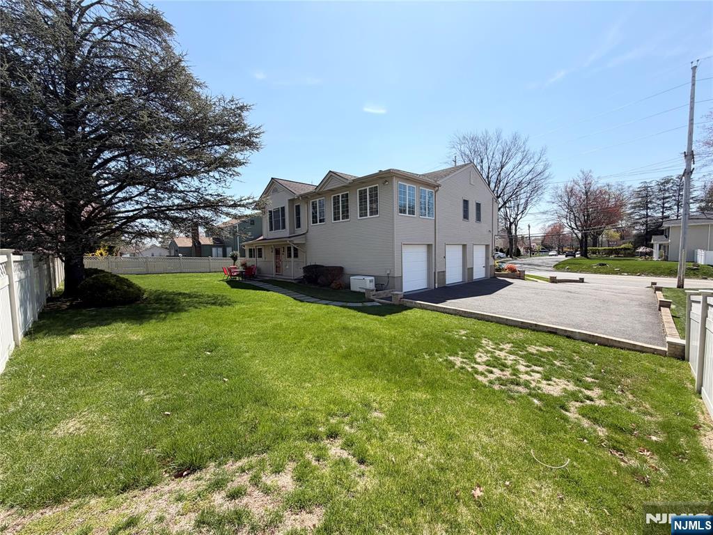 850 Ridgewood Avenue Oradell, NJ 07649 - Photo 46 of 48 a view of a house with a big yard and large tree