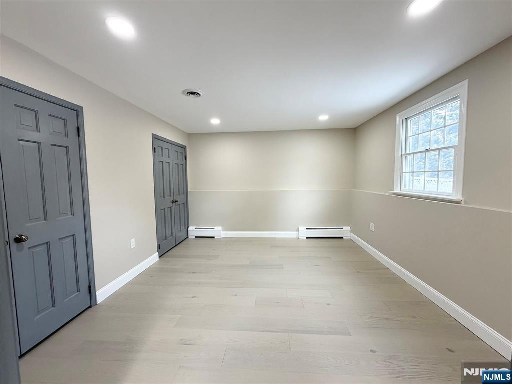 850 Ridgewood Avenue Oradell, NJ 07649 - Photo 6 of 48 an empty room with windows and closet