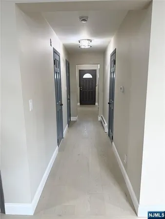 a view of an empty room and a window