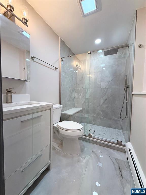 850 Ridgewood Avenue Oradell, NJ 07649 - Photo 9 of 48 a bathroom with a sink a toilet and shower