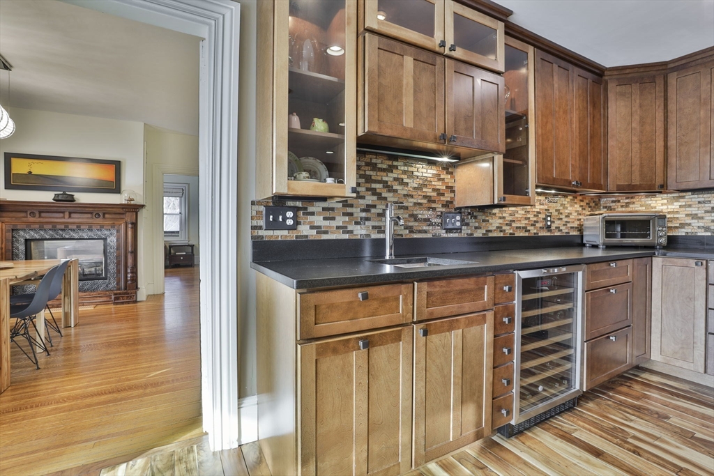 630 Brush Hill Road Milton, MA 02186 - Photo 12 of 41 a kitchen with stainless steel appliances granite countertop a stove and cabinets