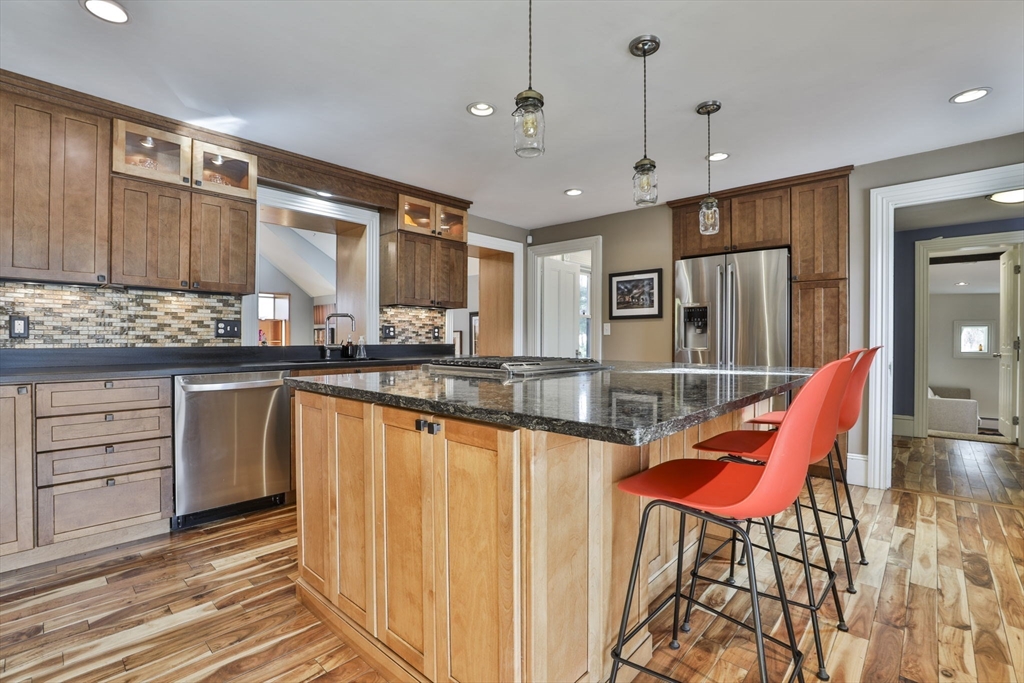 630 Brush Hill Road Milton, MA 02186 - Photo 14 of 41 a very nice looking kitchen with granite countertop a large counter space and stainless steel appliances