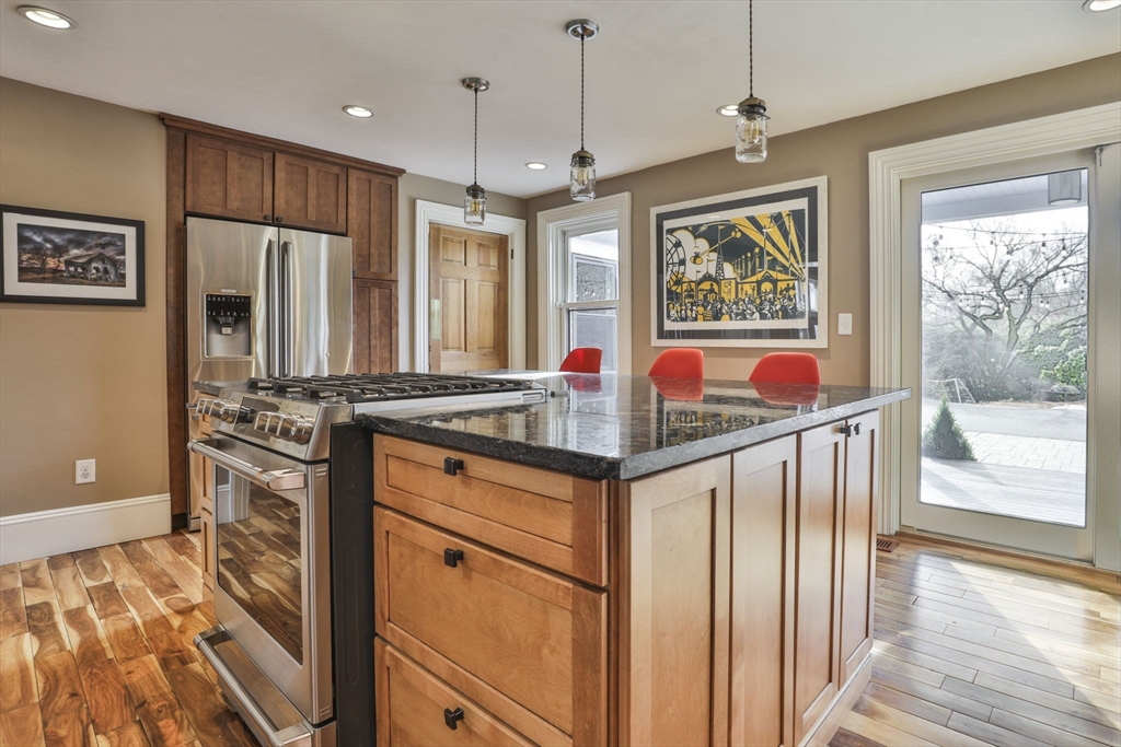 630 Brush Hill Road Milton, MA 02186 - Photo 17 of 41 a kitchen with stainless steel appliances granite countertop a stove refrigerator and wooden floor