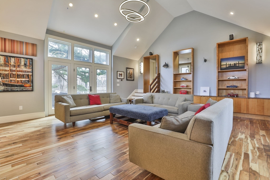 630 Brush Hill Road Milton, MA 02186 - Photo 20 of 41 a living room with furniture and a flat screen tv