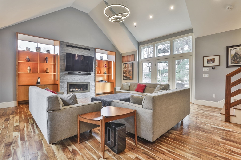 630 Brush Hill Road Milton, MA 02186 - Photo 22 of 41 a living room with fireplace furniture and a large window