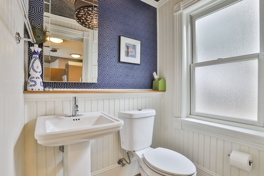 630 Brush Hill Road Milton, MA 02186 - Photo 24 of 41 a bathroom with a sink toilet and mirror