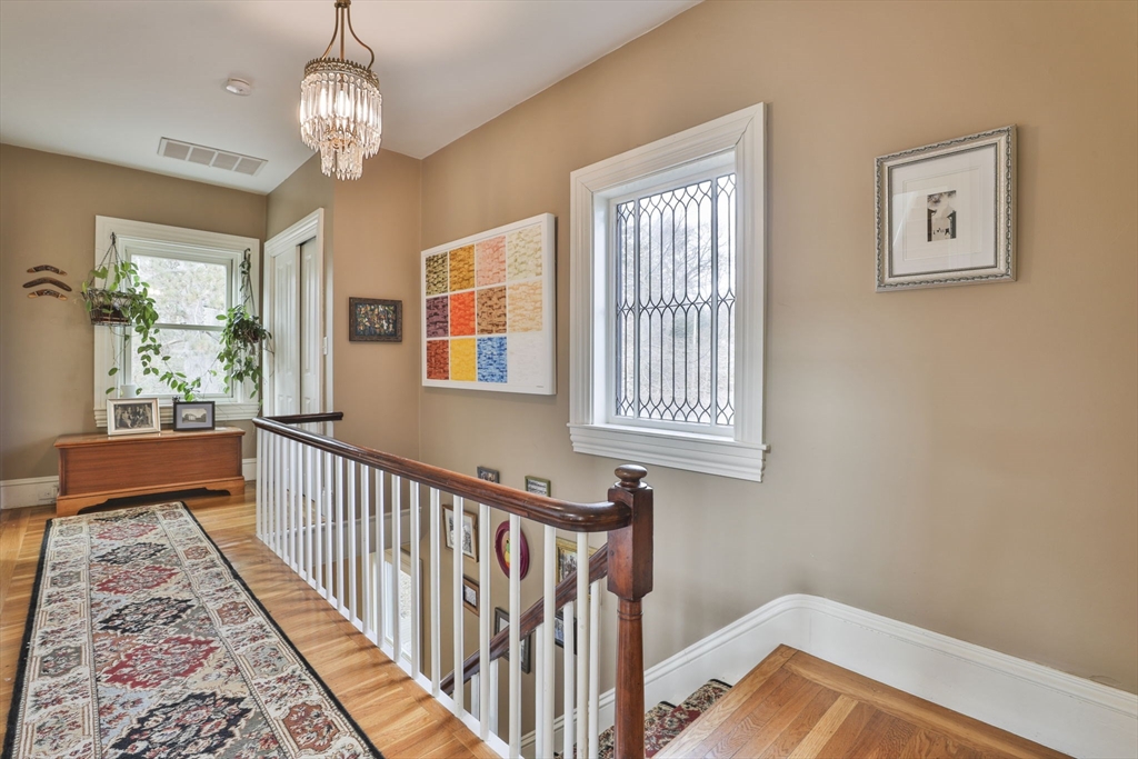 630 Brush Hill Road Milton, MA 02186 - Photo 29 of 41 a view of a hallway to a livingroom with furniture