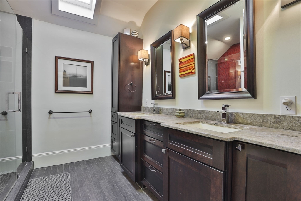 630 Brush Hill Road Milton, MA 02186 - Photo 31 of 41 a bathroom with a sink vanity and a mirror