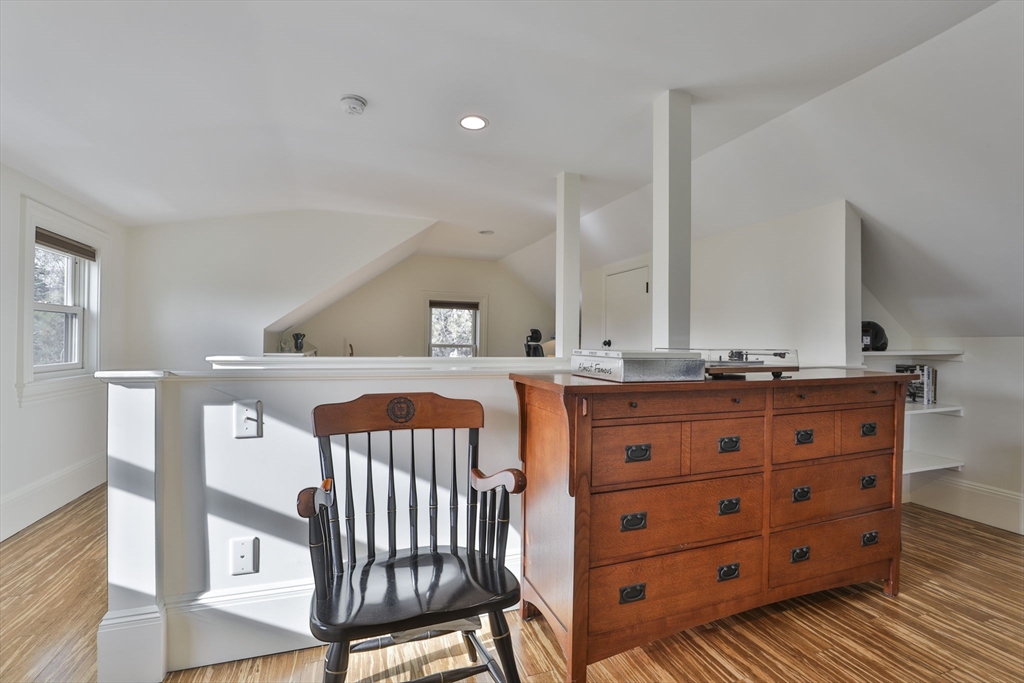 630 Brush Hill Road Milton, MA 02186 - Photo 33 of 41 a living room with furniture a mirror and a dresser