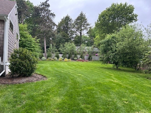 630 Brush Hill Road Milton, MA 02186 - Photo 37 of 41 a view of a garden with a fountain