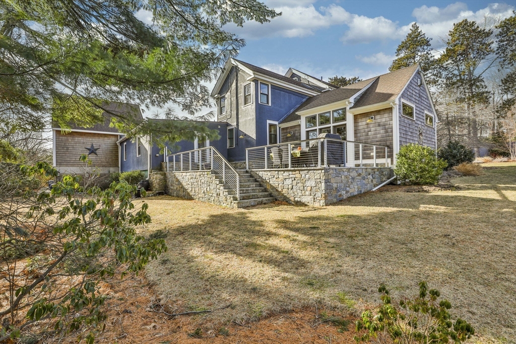 630 Brush Hill Road Milton, MA 02186 - Photo 39 of 41 a view of a house with a yard