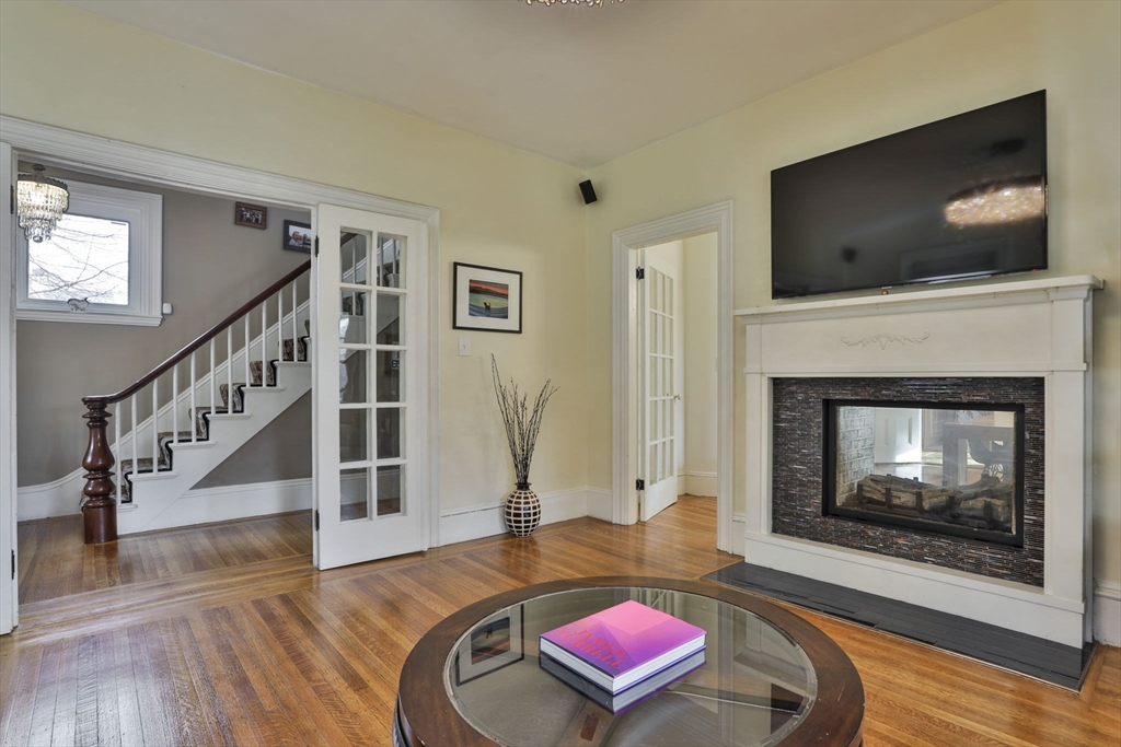 630 Brush Hill Road Milton, MA 02186 - Photo 4 of 41 a living room with furniture and a flat screen tv