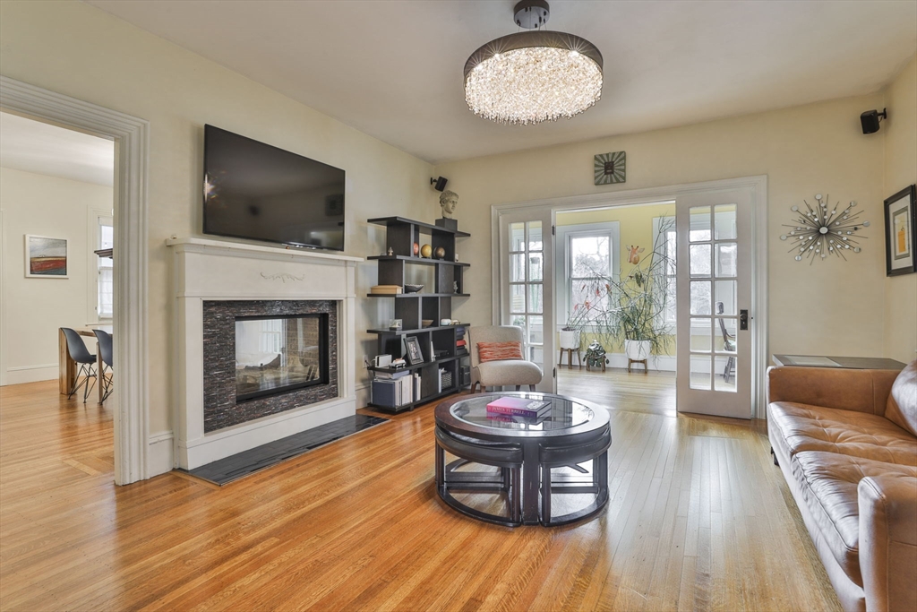 630 Brush Hill Road Milton, MA 02186 - Photo 5 of 41 a living room with furniture and a fireplace