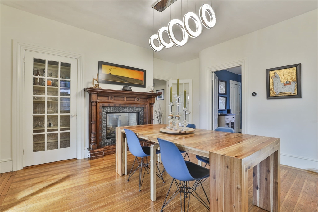 630 Brush Hill Road Milton, MA 02186 - Photo 8 of 41 a view of a dining room with furniture window and wooden floor