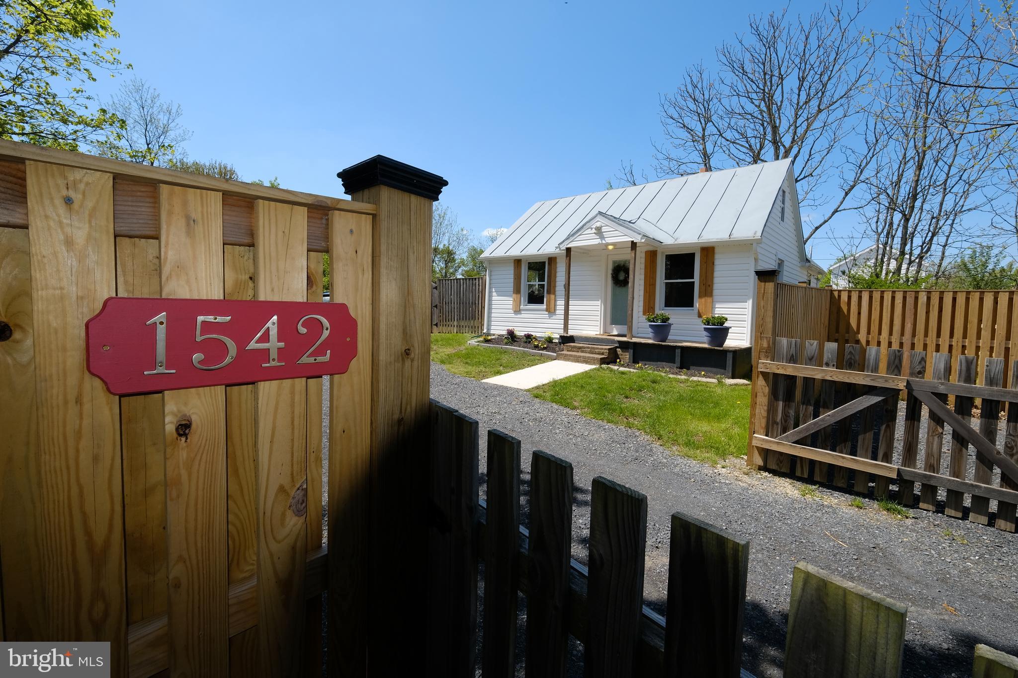 1542 Senseny Road Winchester, VA 22602 - Photo 2 of 23 a view of a house with backyard porch and furniture