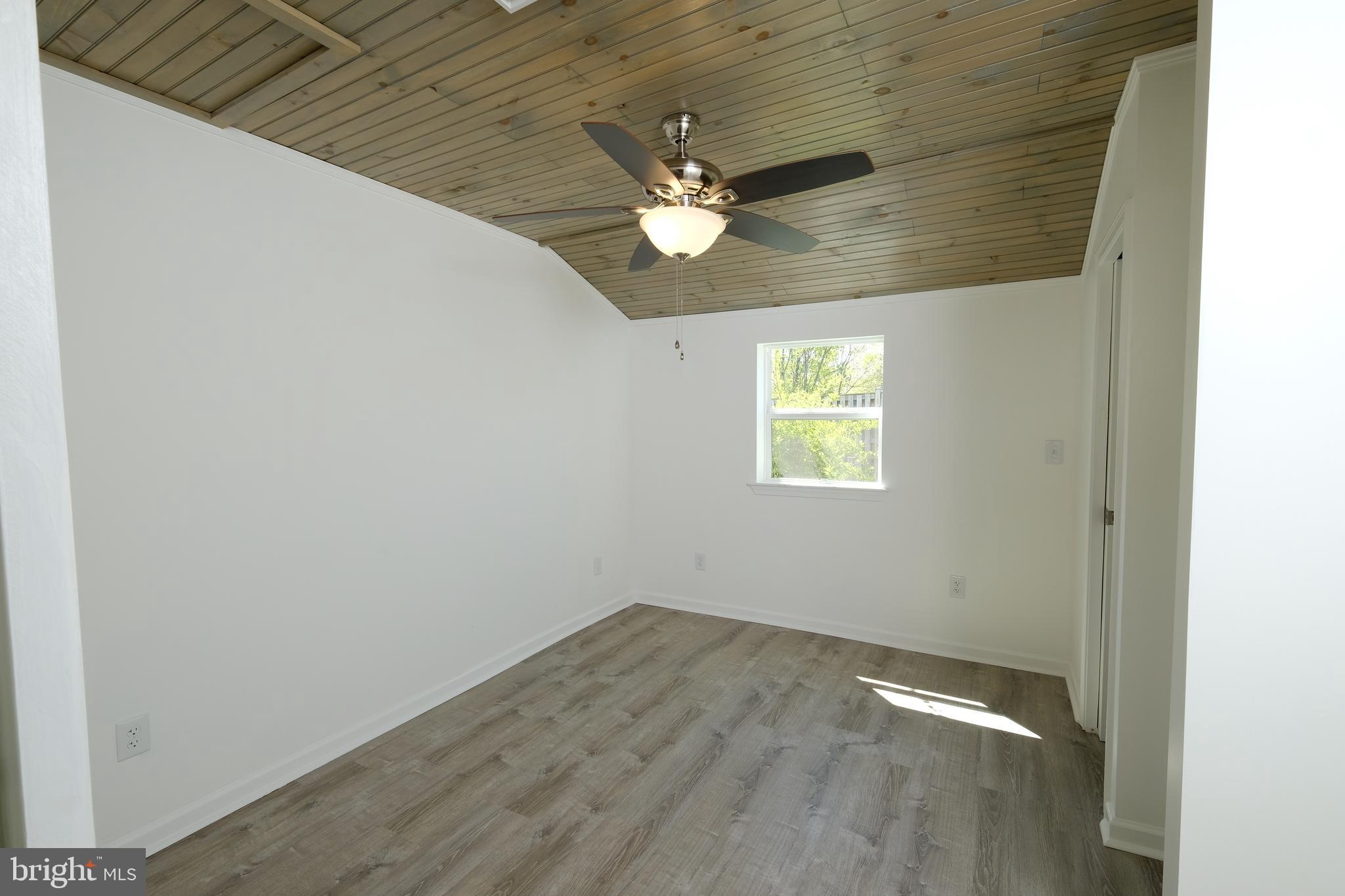 1542 Senseny Road Winchester, VA 22602 - Photo 19 of 23 an empty room with closet and a chandelier fan