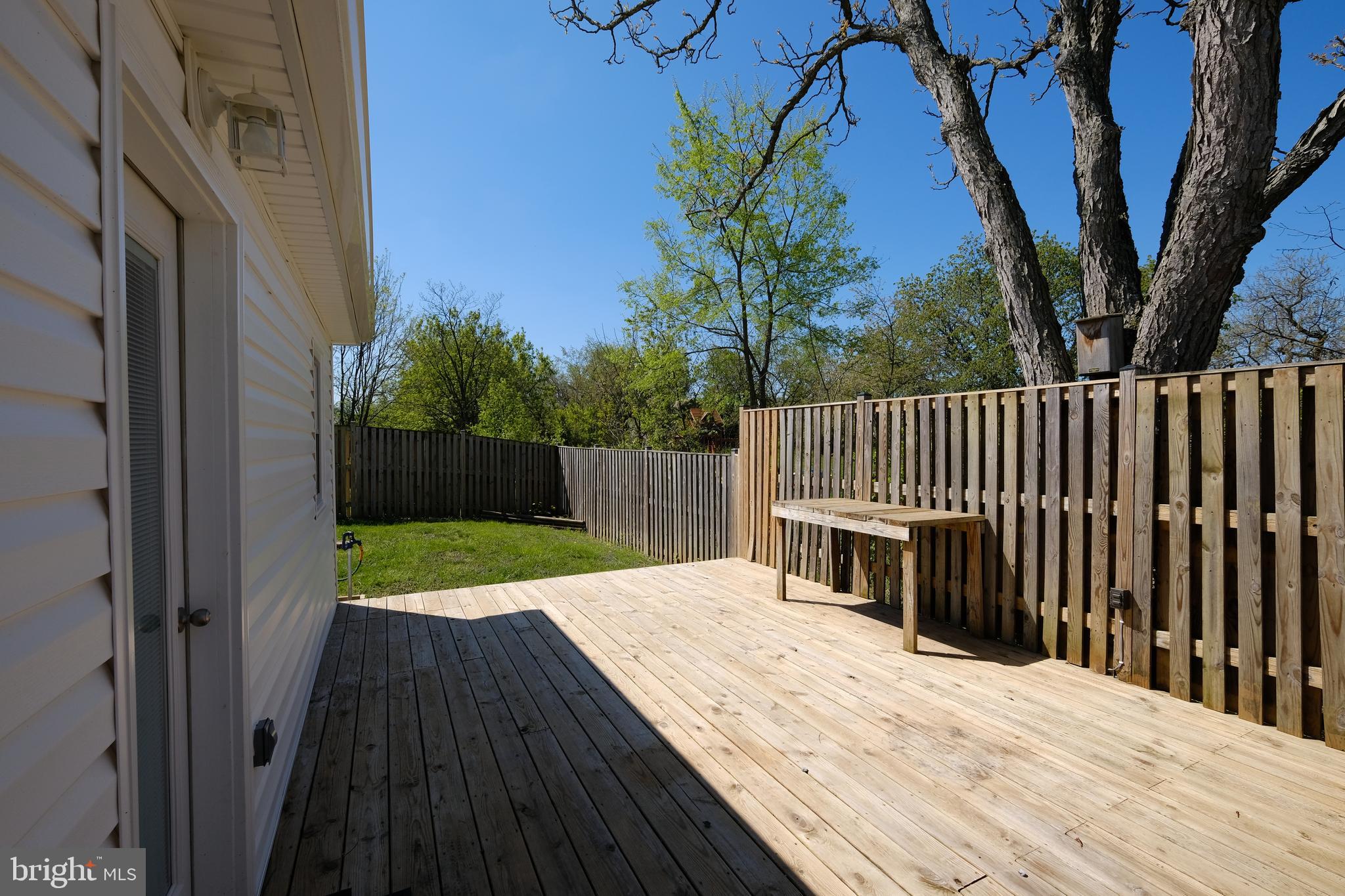 1542 Senseny Road Winchester, VA 22602 - Photo 22 of 23 a view of backyard with wooden fence and trees